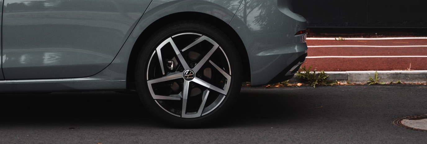 Detailed photo of a classic car's wheels.